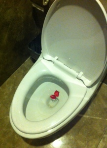 Nothing says "class" light red flower petals in your toilet.