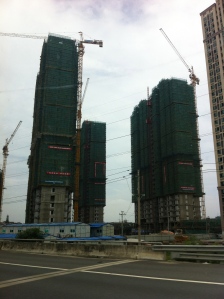 I was fascinated by the building that is going on in the countryside.  These massive apartment buildings are everywhere.  It seems that China is working on a relocation program where farmers and peasants will be moved to these high-rise apartments.  I'm not sure that's going to work out.